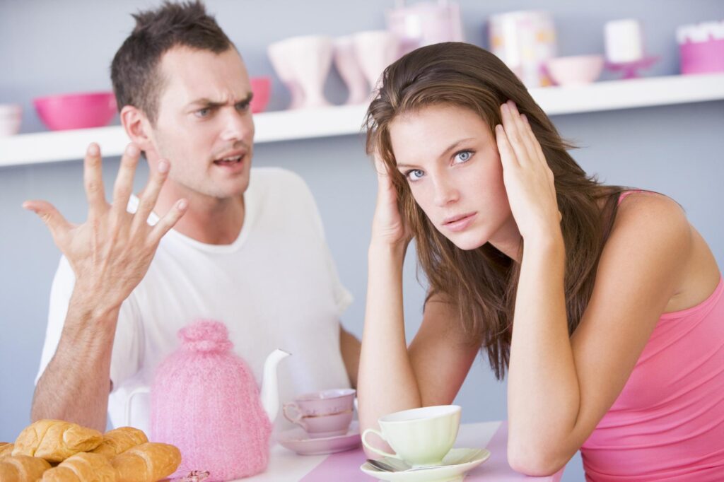 A couple is arguing at the breakfast table