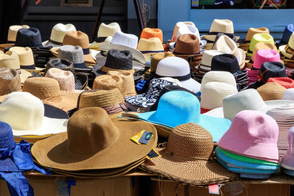 Buying the perfect sun hat. Pictured is a variety of sun hats.