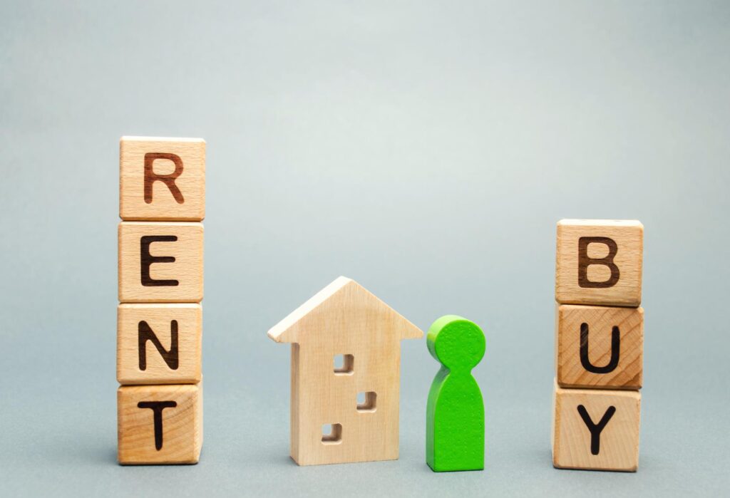 renting a home vs buying a home. Wooden blocks with the word Rent or buy and a person stands near the house. Make the right decision. Real estate concept. Rent apartment. Property. Rental, renting home. Buying. Purchase housing