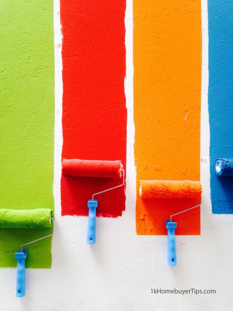 four colors of paint on a wall with rollers - interior painting