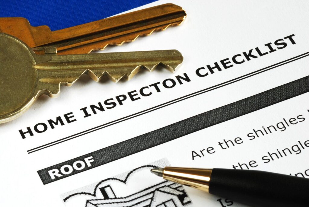 home inspection checklist with paper and pen